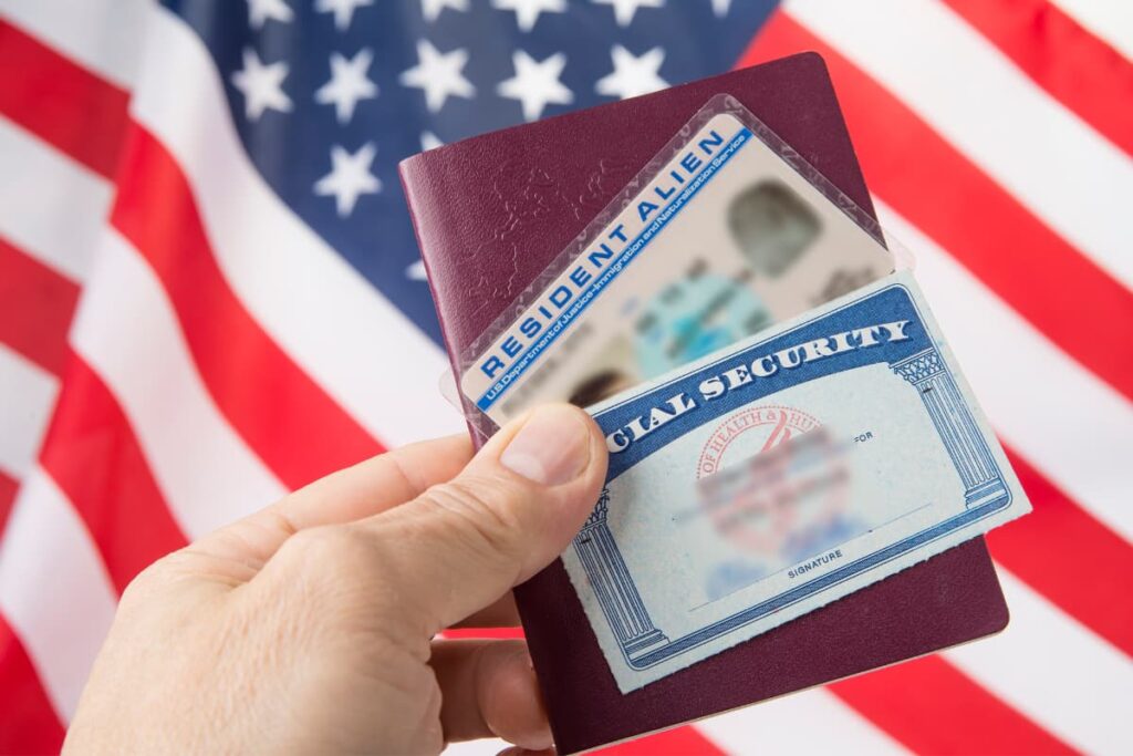 An image consists of two credit cards with one wallet along with American National Flag.