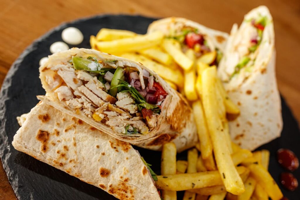Wendy's Wraps Filled with Chicken and French Fries Served on Black Rock