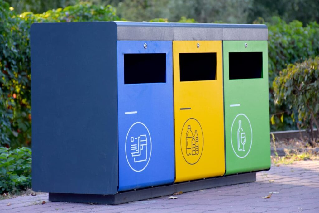 Walmart Automatic Trash Cans   appeared in green, red, blue colors in a green garden.