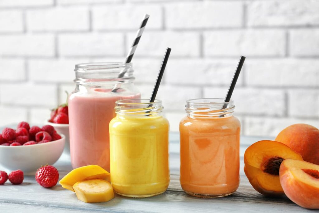 Chick Fil A Shakes serves in a small jars along with the straws. Chick Fil A a shakes comes with different flavors(Strawberry, Mango and peaches). Some strawberries are kept in a 2 white cups, 2 mango slices and some peaches slices are kept on the floor.