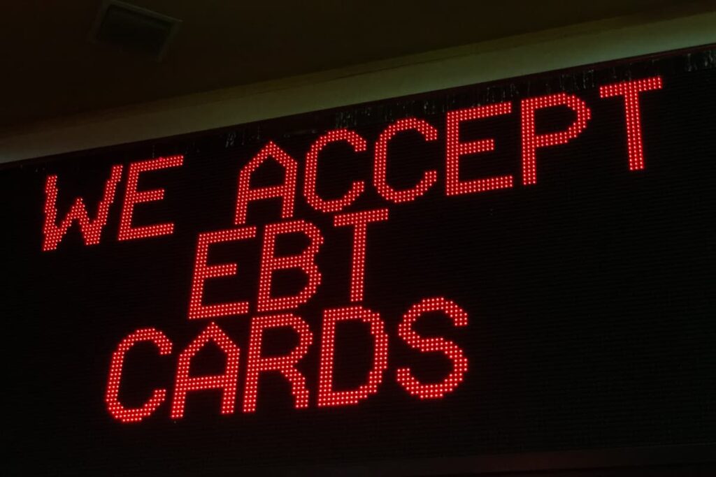 Chick Fil A Take EBT Cards for payments. On a black screen there is written "We accept EBT Cards" in red colour.