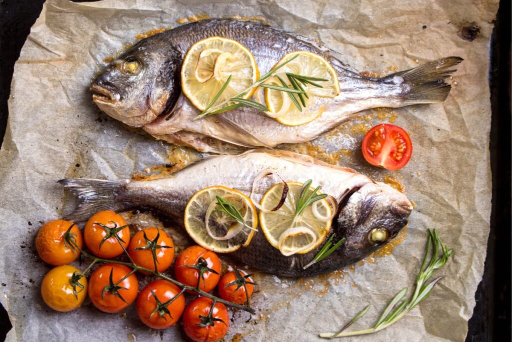 Walmart Fish ( Gilt-head bream
Fish) served with four slices of lemon, nine Heirloom tomatoes, fried onions and rosemary leaves.