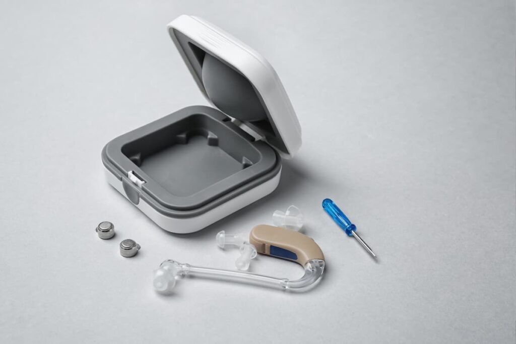 Walmart Hearing Aids set along with screwdriver, two mini batteries in a mini box.