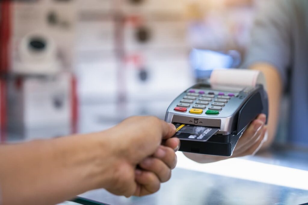 Lowe's Credit Card is inserted in a payment accept machine to process the payment by a customer for their product purchase at the store.