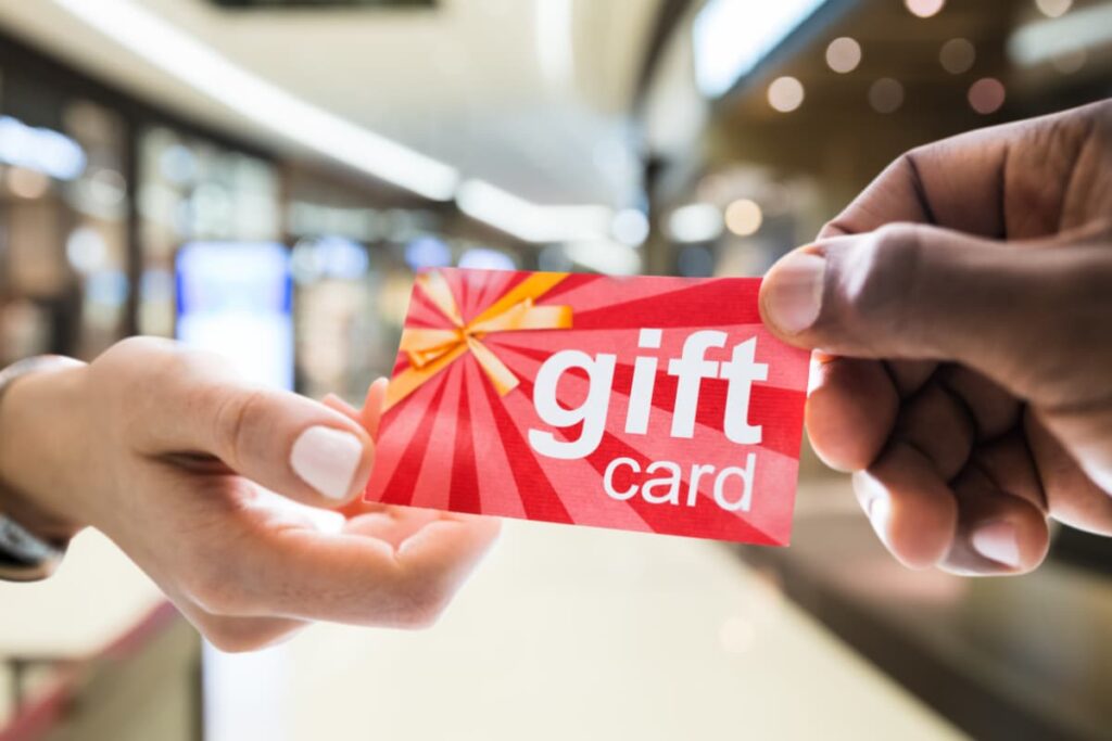 Chick-fil-a Gift Card is sharing from one to another person. Red color gift card, gift card spelling is mentioned on white color.