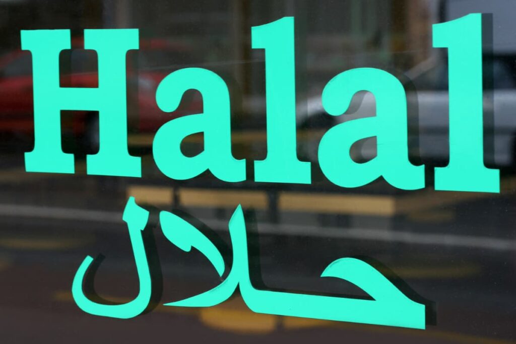Chick-Fil-A Halal in English is displayed on the screen which is green in color. Below halal there is an arabic word which means halal in green in color.