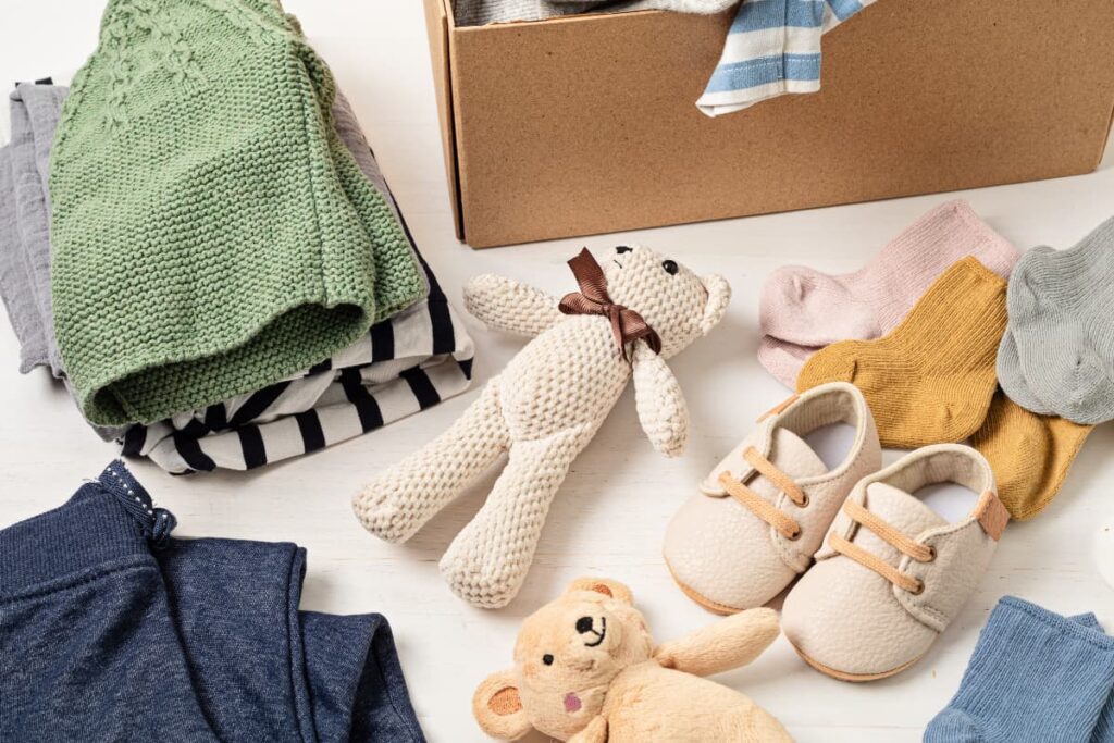 Walmart Baby Box contains  woolen hat, shoes, clothes, and teddy toys.