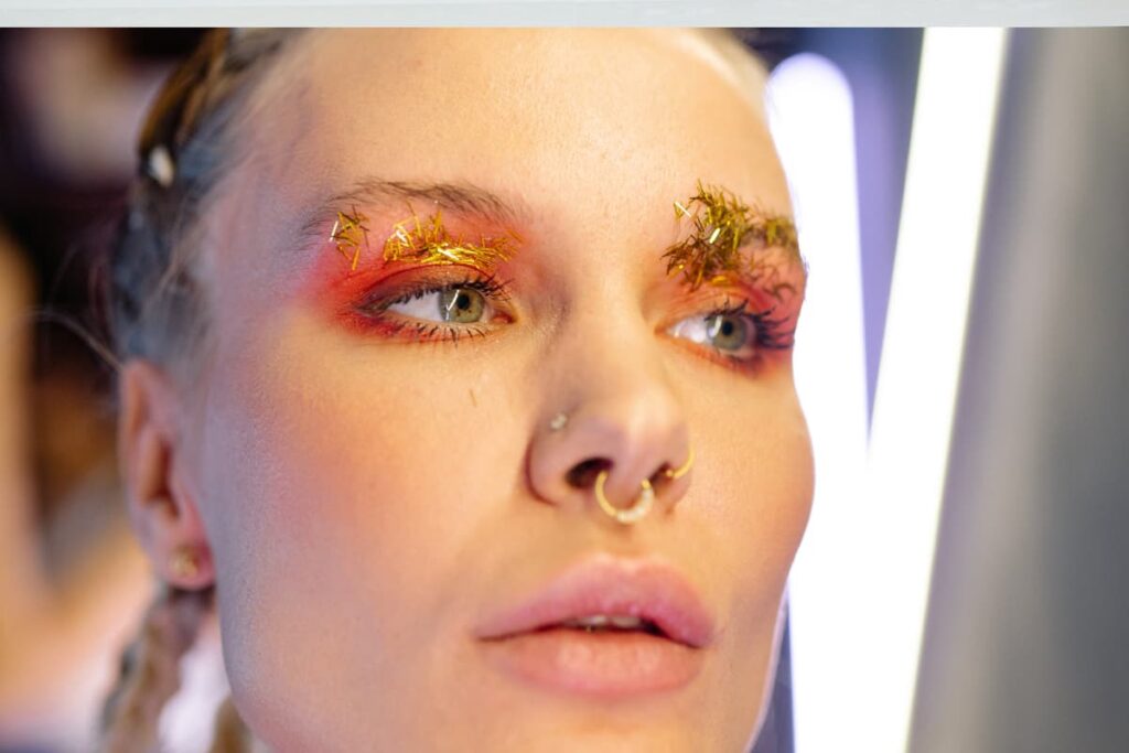 Walmart Nose Rings wore by a women with three different style nose rings.