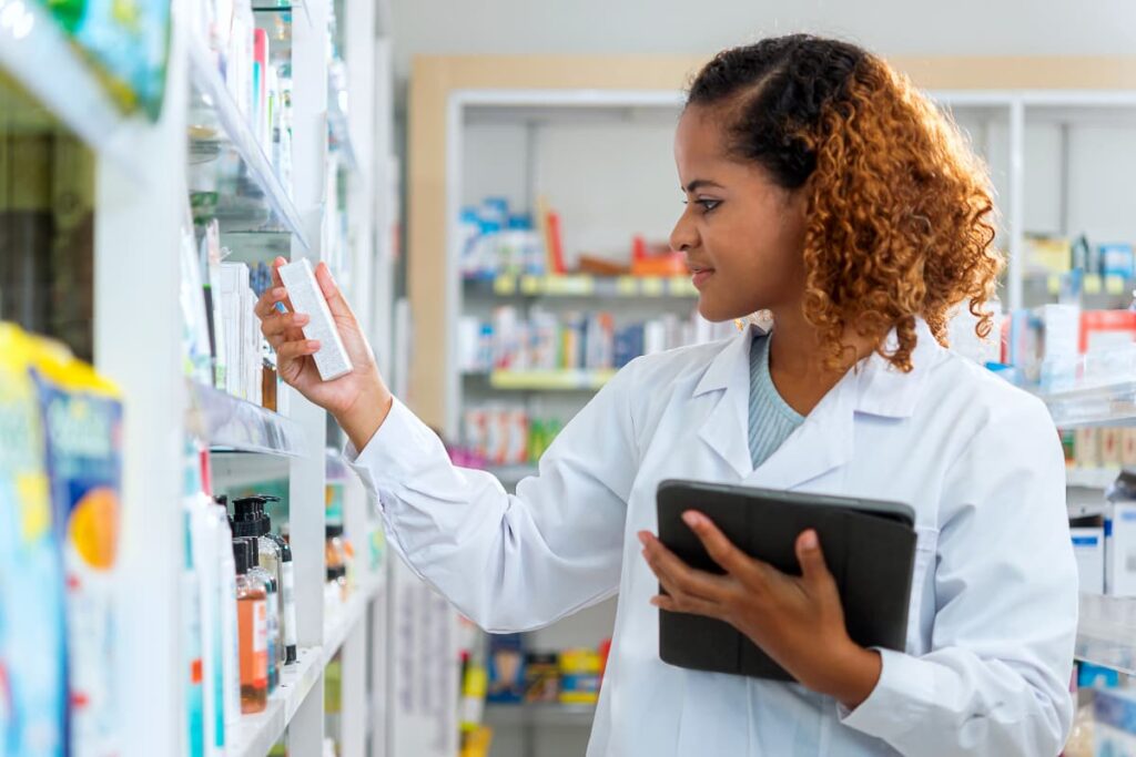Walmart Stores are checked for valid medicines using iPad by Pharmacist girl.