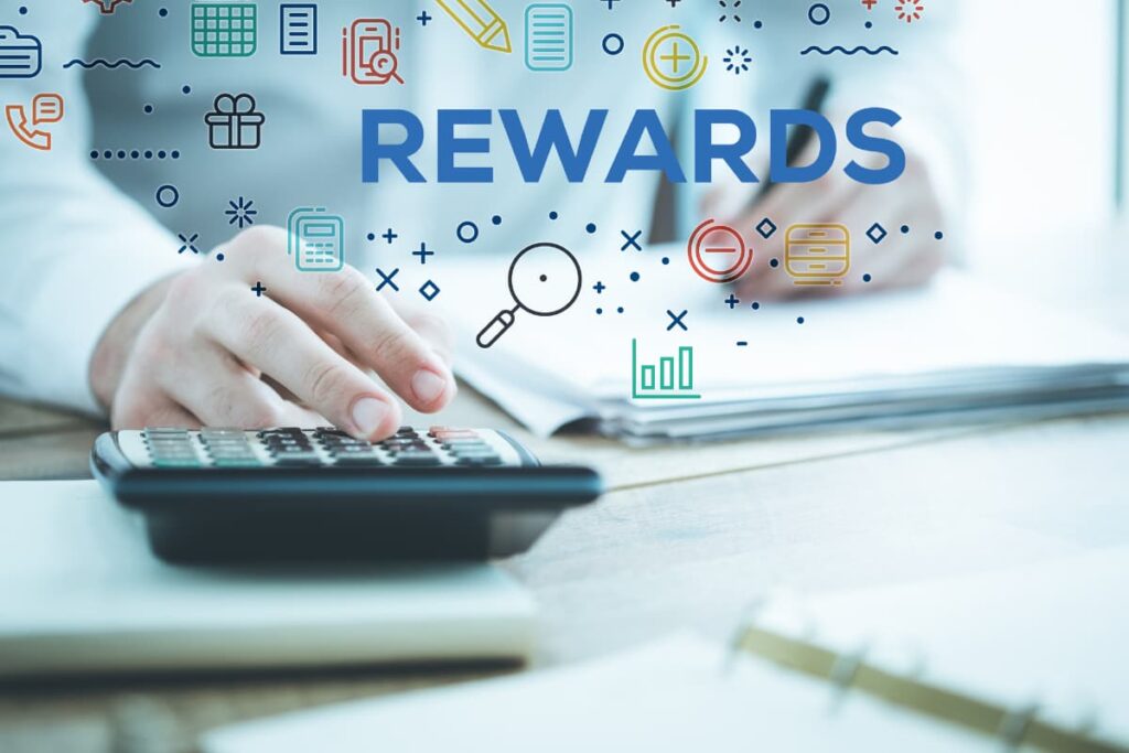 Rewards Program At Walmart earn rewards by using calculator, some papers and pen.