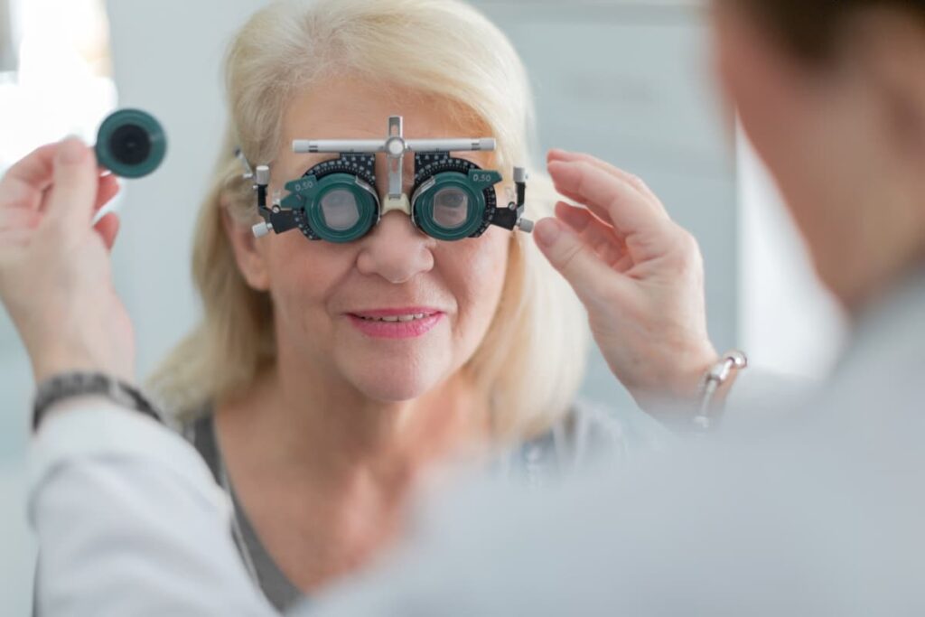 Walmart Vision Center conducted an eye exam to a old women with the help of eye testing machine by Doctor. 