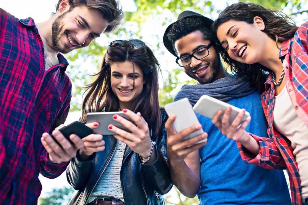 Walmart Connect used by two men and two women with the help of their mobile phones.