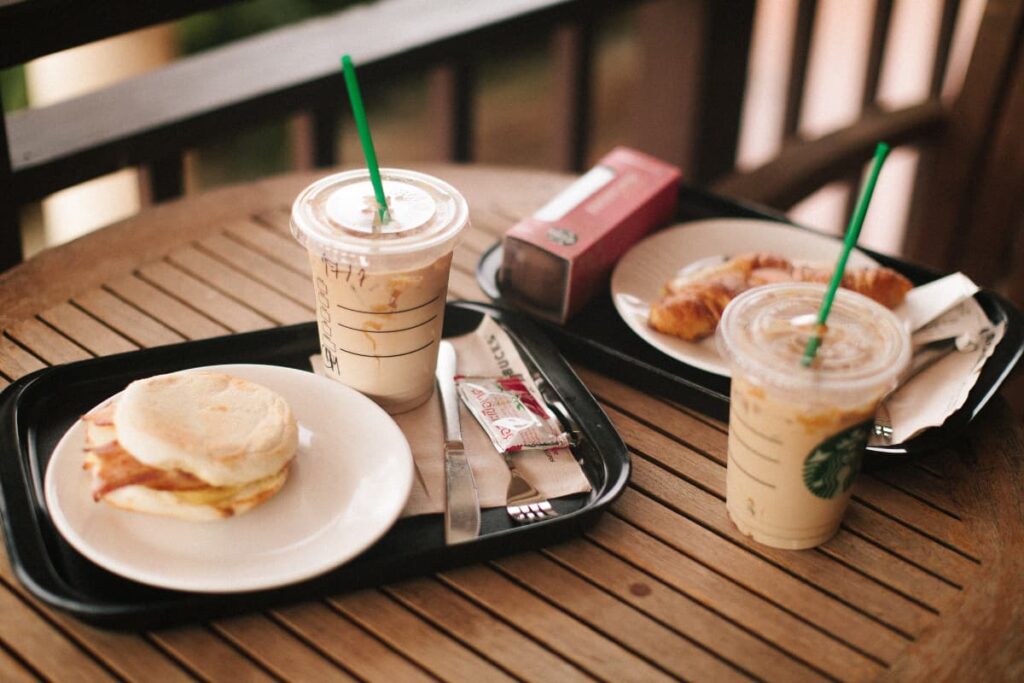 In Starbucks you have so many options to order. Starbucks has coffee, ice tea, burgers, sandwiches, muffins, desserts, drinks, all are served in a black saucer along with the ketchup, knives, forks, and some tissues.