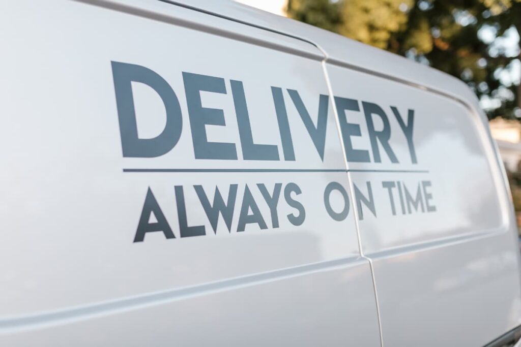 Starbucks Delivers their packages on time. Here there is a poster which is having Delivery Always On Time on the White screen.