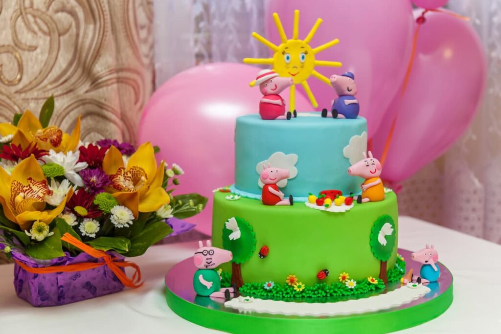 Custom Cakes at Safeway decorated with Peppa pig theme , balloons and flowers.