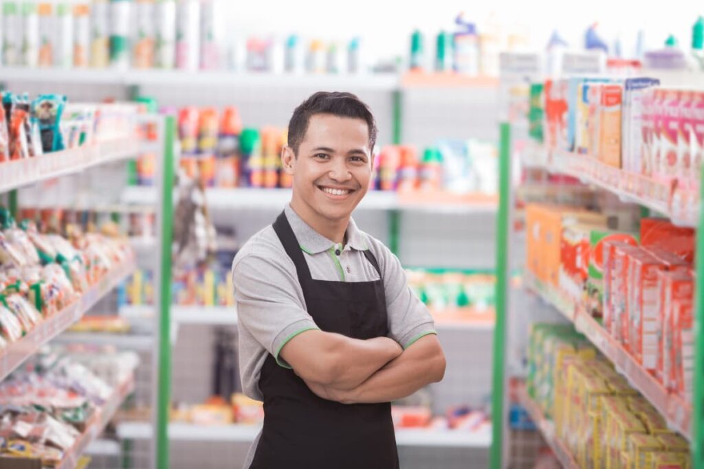 Dress Code At Publix employee wears blue color apron with grey t shirt at the store. 